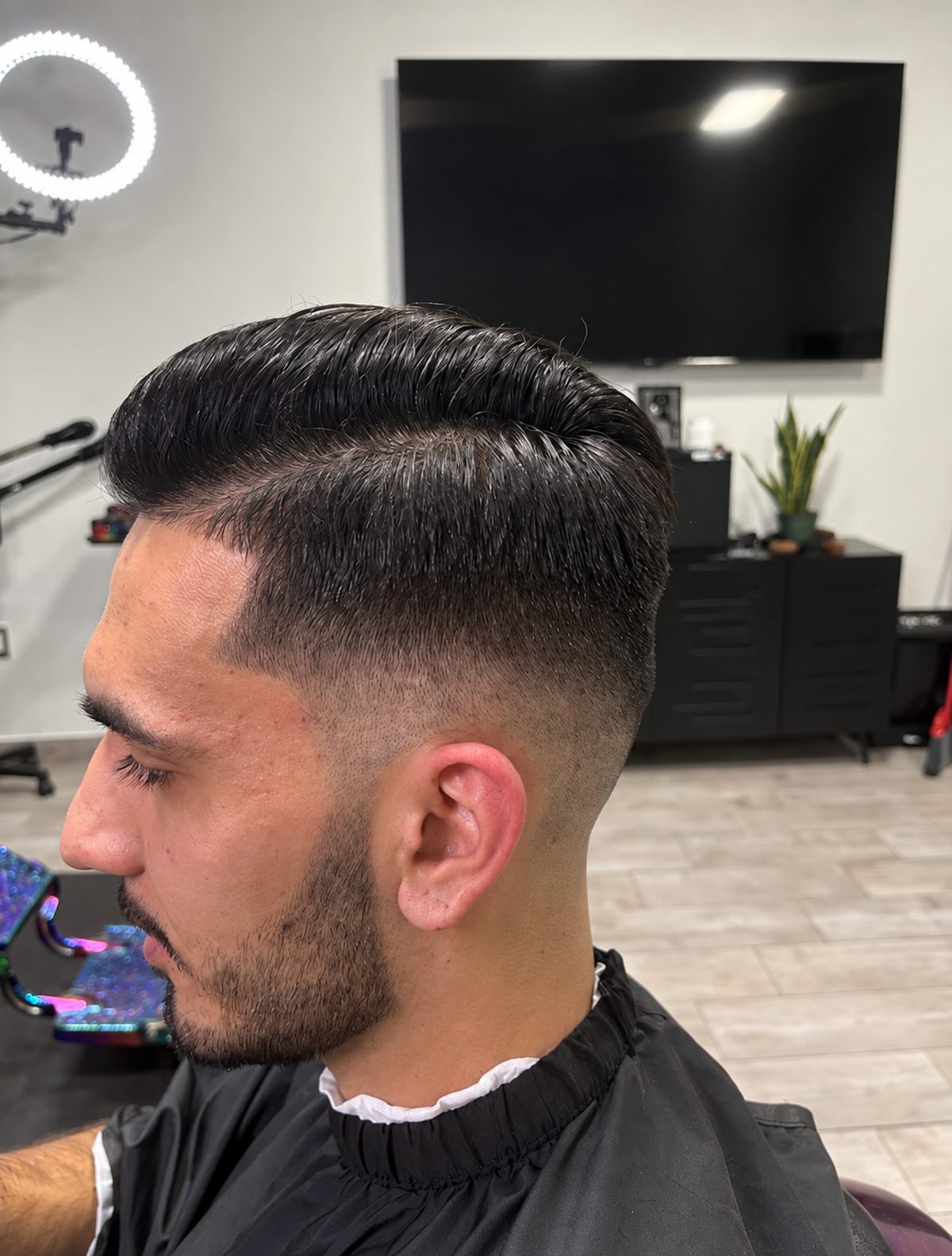Side part with a skin fade